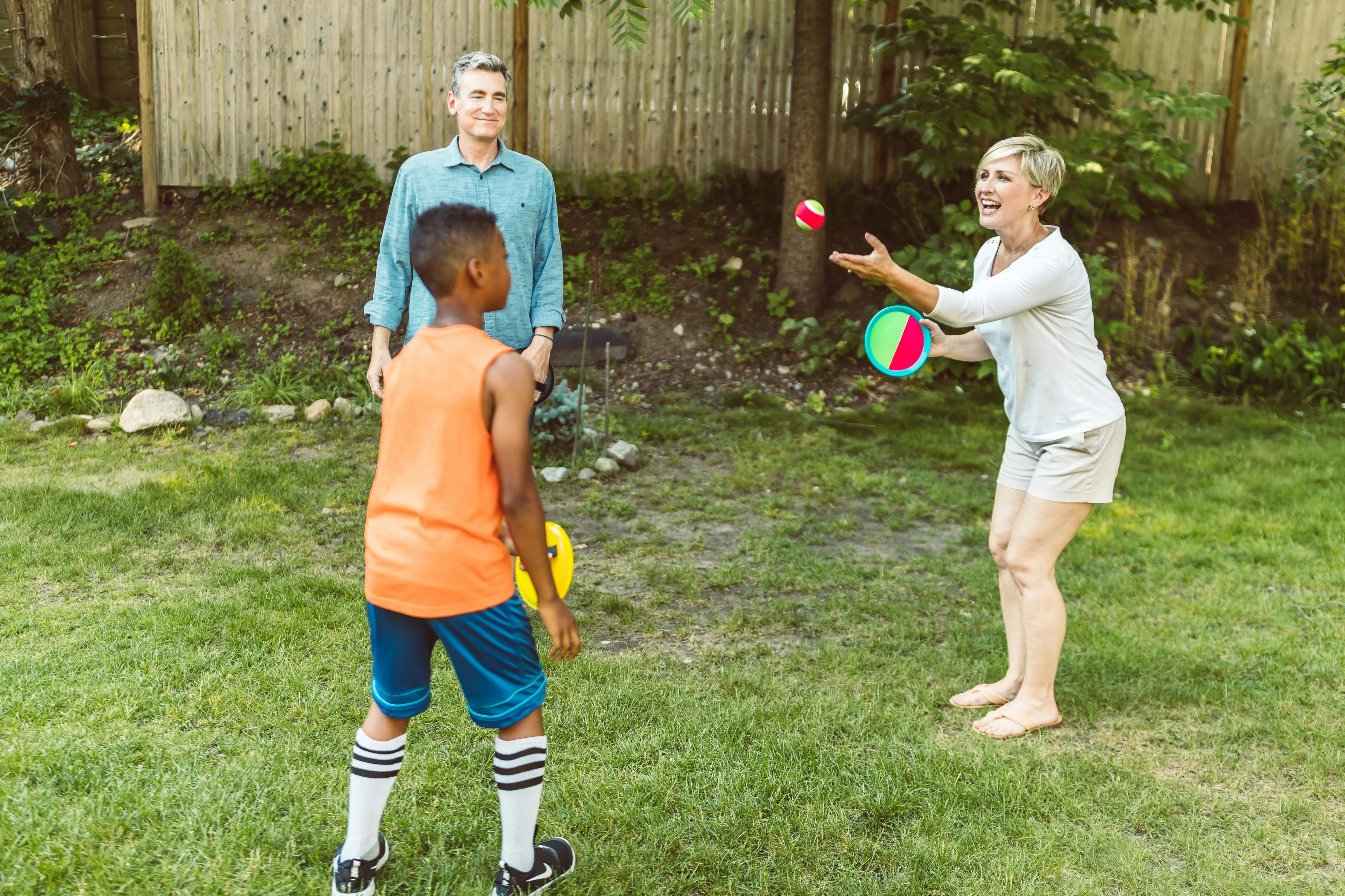 A family playing a ball game outdoors