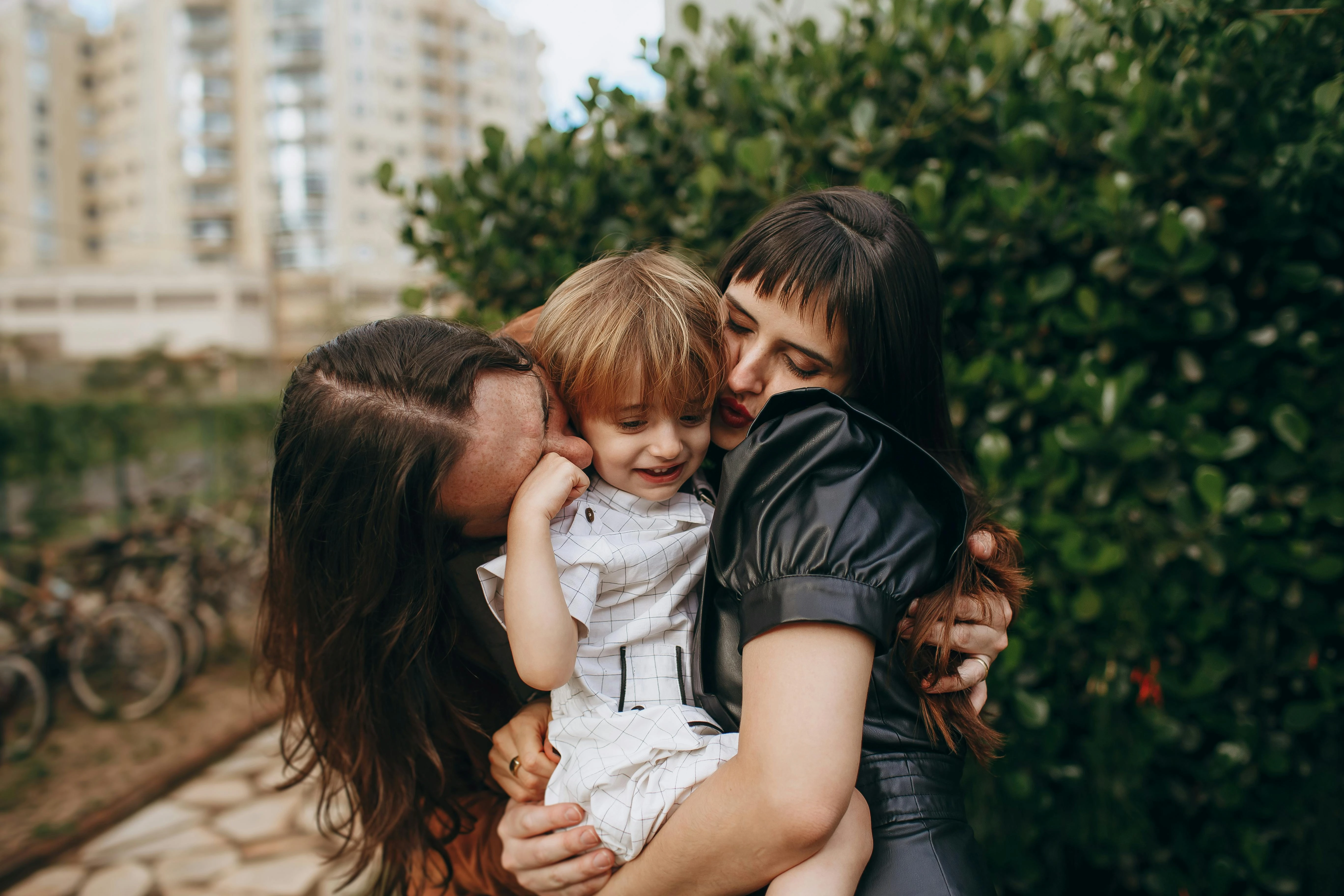 A family sharing an embrace outdoors